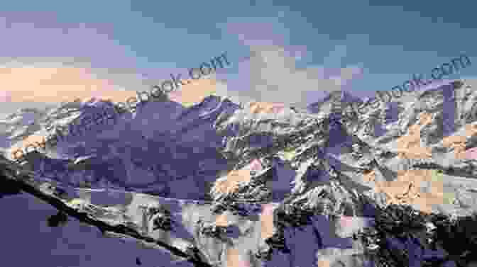 A Majestic Panorama Of The Swiss Alps, Their Snow Covered Peaks Reaching Into The Heavens ng The Things In Switzerland