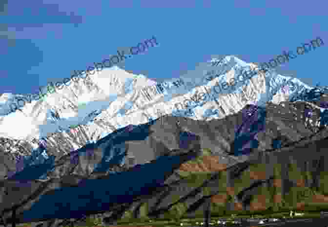 A Panoramic View Of Tengeriin Khuu, Showcasing Its Snow Capped Summit And Rugged Slopes The Sky Son: Tengeriin Khuu