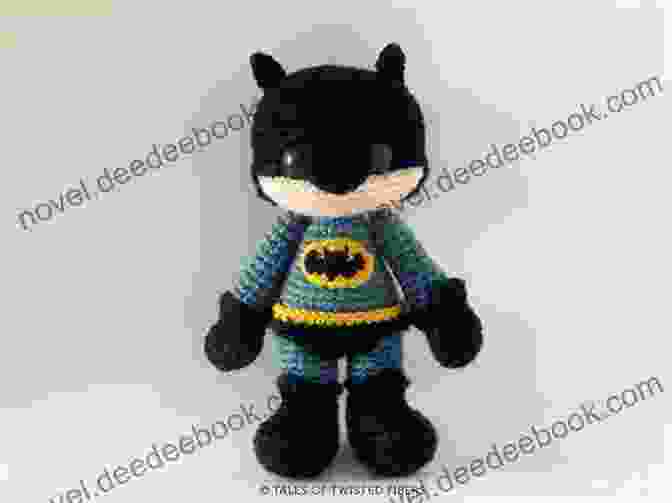 Amigurumi Of Batman With A Black Body, White Cape, And A Crocheted Bat Symbol On Its Chest The Friendly Superhero: Superhero Amigurumi Ideas: Black White
